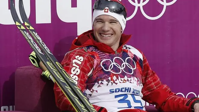 epa04076758 Dario Cologna of Switzerland sits on the leader's chair in the finish area during the Men's 15km Classic competition in Laura Cross-country Ski & Biathlon Center at the Sochi 2014 Olympic Games, Krasnaya Polyana, Russia, 14 February 2014. EPA/PETER KLAUNZER