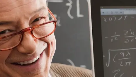 Professor holding tablet computer --- Image by © Sean De Burca/Corbis