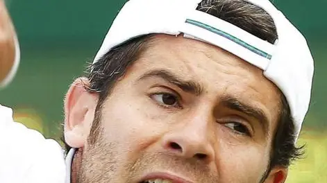 epa04282650 Simone Bolelli of Italy serves to Philipp Kohlschreiber of Germany in their second round match during the Wimbledon Championships at the All England Lawn Tennis Club, in London, Britain, 26 June 2014. EPA/VALDRIN XHEMAJ