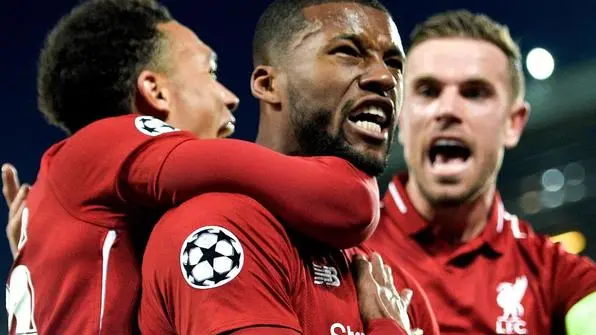 epa07554614 Liverpool's Georginio Wijnaldum (C) celebrates with teammates after scoring the 3-0 goal during the UEFA Champions League semi final second leg soccer match between Liverpool FC and FC Barcelona at Anfield stadium in Liverpool, Britain, 07 May 2019. EPA/PETER POWELL