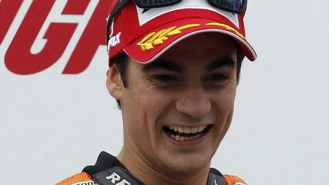 11 Nov 2012, Cheste, Spain --- epa03467049 Spanish MotoGP rider Dani Pedrosa of Honda celebrates of the podium after winning Valencia's MotoGP Grand Prix, the last race of Moto GP's world championship 2012, at Ricardo Tormo racetrack in Cheste, near Valencia, eastern Spain, 11 November 2012. EPA/JUAN CARLOS CARDENAS --- Image by © JUAN CARLOS CARDENAS/epa/Corbis