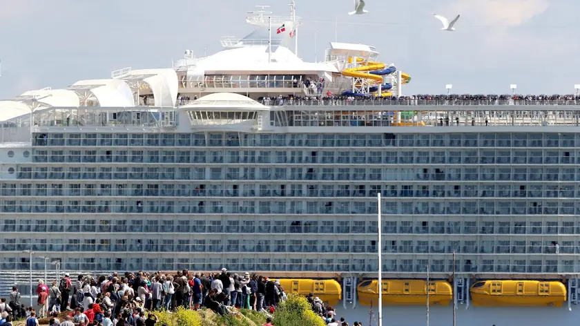 epa05307644 The cruise ship Harmony of the Seas leaves the port of St. Nazaire, France, 15 May 2016. This Royal Caribbean Cruise Line ship from STX France is the world's largest cruise ship. It will join Southampton before starting his first cruise in the coming days. EPA/EDWARD BOONE