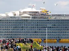 epa05307644 The cruise ship Harmony of the Seas leaves the port of St. Nazaire, France, 15 May 2016. This Royal Caribbean Cruise Line ship from STX France is the world's largest cruise ship. It will join Southampton before starting his first cruise in the coming days. EPA/EDWARD BOONE