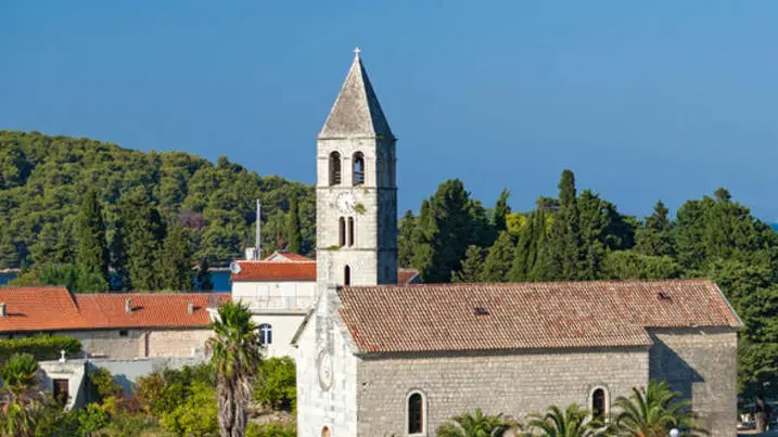 VIS, CROATIA - AUGUST 19, 2012: St. Juraj church, the first sight which greets visitors to on arrival to Vis, the furthest Croatian inhabited island.