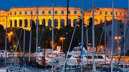 13 May 2007, Pula --- Dusk over marina and the Roman Amphitheatre, Pula, Istria, Croatia, Adriatic, Europe --- Image by © Stuart Black/Robert Harding World Imagery/Corbis