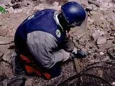 Bosnia and Herzegovina --- A Bosnian mine defuser prepares to defuse a land mine. --- Image by © Bojan Brecelj/CORBIS