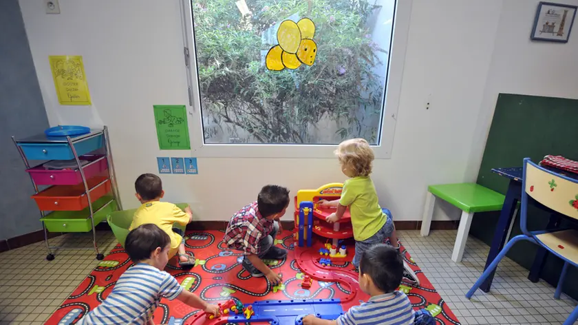 Children play in a classroom of the Notre-Dame de la Sagesse private nursery school at an early start of a new school year on August 27, 2012 in Nantes, western France. AFP PHOTO FRANK PERRY (Photo credit should read FRANK PERRY/AFP/GettyImages)
