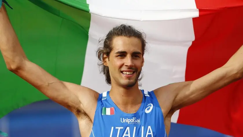 (FILE) Italy's Gianmarco Tamberi celebrates after winning the gold medal in the men's high jump during the European Athletics Championships in Amsterdam, the Netherlands, Sunday, July 10, 2016. (ANSA/AP Photo/Matthias Schrader)