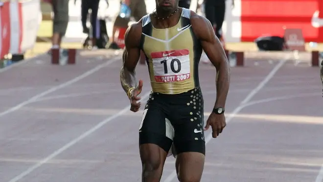 20070909 - RIETI - SPR : ATLETICA: 100 M, POWELL RECORD DEL MONDO CON 9''74. Il giamaicano Asafa Powell (S) e Saidy Ndure Jaysuma (Gambia) durante la gara. Powell ha stabilito il nuovo record del mondo dei 100 m con 9''74, migliorando il suo record precedente di 9''77. ANSA / CLAUDIO PERI / PAL