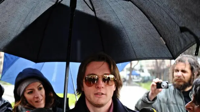 Raffaele Sollecito (L) leaves the court in Florence, Italy, 30 January 2014. ANSA/MAURIZIO DEGL' INNOCENTI