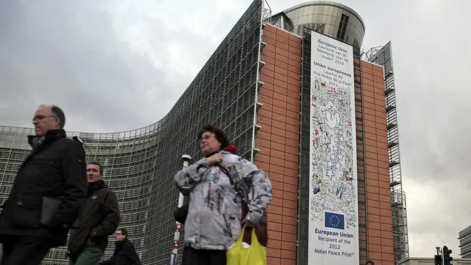 epa03503783 A giant placard announces the European Union as Nobel Peace Prize 2012 laureate on the facade of the European comission building in Brussels, Belgium, 10 December 2012. Leaders of the European Union today accepted the Nobel Peace Prize, pledging to continue to 'fight for lasting peace, freedom and justice' and defending the joint euro currency. European Council President Herman Van Rompuy said in his speech that while 'war is as old as Europe,' through reconciliation former European enemies had bridged differences, citing the examples of France and Germany. European Commission President Jose Manuel Barroso said the EU had moved from 'pooling coal and steel, to abolishing internal borders' and had expanded from six to soon 28 members with the addition of Croatia in 2013. EPA/OLIVIER HOSLET