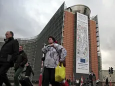 epa03503783 A giant placard announces the European Union as Nobel Peace Prize 2012 laureate on the facade of the European comission building in Brussels, Belgium, 10 December 2012. Leaders of the European Union today accepted the Nobel Peace Prize, pledging to continue to 'fight for lasting peace, freedom and justice' and defending the joint euro currency. European Council President Herman Van Rompuy said in his speech that while 'war is as old as Europe,' through reconciliation former European enemies had bridged differences, citing the examples of France and Germany. European Commission President Jose Manuel Barroso said the EU had moved from 'pooling coal and steel, to abolishing internal borders' and had expanded from six to soon 28 members with the addition of Croatia in 2013. EPA/OLIVIER HOSLET