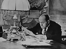 February 1931 --- Italian Premier Benito Mussolini, photographed at his desk in his headquarters in Rome, Italy, February 1931. --- Image by © CORBIS