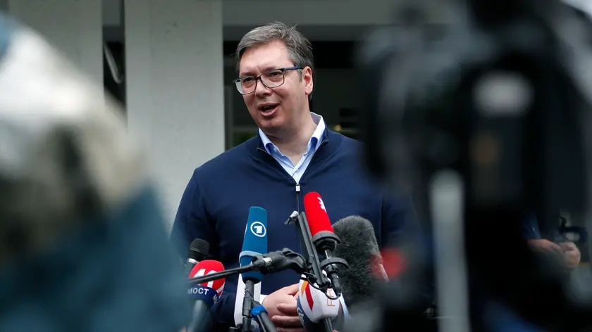 Serbia\'s President Aleksandar Vucic, addresses the media outside a polling station, in Belgrade, Serbia, Sunday, June 21, 2020. Serbia\'s ruling populists are set to tighten their hold on power in a Sunday parliamentary election held amid concerns over the spread of the coronavirus in the Balkan country and a partial boycott by the opposition. (AP Photo/Darko Vojinovic)