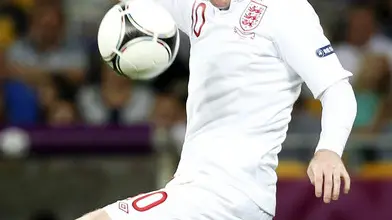 24.06.2012. UKRAINE, Kiev : Euro 2012 football championships quarter-final match England vs Italy on June 24, 2012 at the Olympic Stadium in Kiev. Wayne Rooney controls a high ball