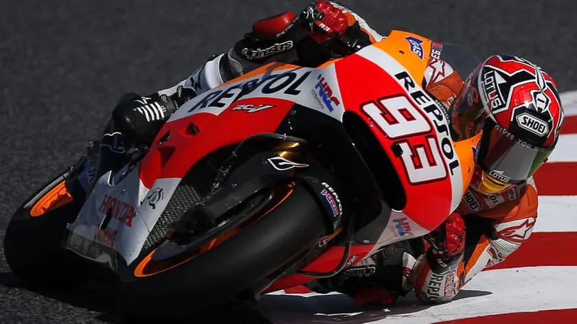 Moto GP rider Marc Marquez of Spain riding for the Honda Team steers his motorcycle during a free practice at the Montmelo racetrack near of Barcelona, Spain, Saturday, June 14, 2014 before Sunday's Spanish Motorcycle Grand Prix. (AP Photo/Andres Kudacki)