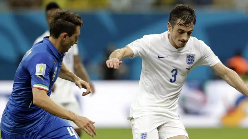 epa04257688 England's Leighton Baines (R) and Italy's Matteo Darmian (C) vie for the ball during the FIFA World Cup 2014 group D preliminary round match between England and Italy at the Arena Amazonia in Manaus, Brazil, 14 June 2014. (RESTRICTIONS APPLY: Editorial Use Only, not used in association with any commercial entity - Images must not be used in any form of alert service or push service of any kind including via mobile alert services, downloads to mobile devices or MMS messaging - Images must appear as still images and must not emulate match action video footage - No alteration is made to, and no text or image is superimposed over, any published image which: (a) intentionally obscures or removes a sponsor identification image; or (b) adds or overlays the commercial identification of any third party which is not officially associated with the FIFA World Cup) EPA/MAST IRHAM EDITORIAL USE ONLY