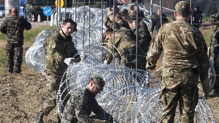 SLOVENIAN ARMY SET UP BARBED WIRE FENCES ON THE SLOVENIAN-CROATIAN BORDER CROSSING IN RESPONSE TO THE MIGRANT CRISIS SLOVENIAN ARMY SET UP BARBED WIRE FENCES ON SLOVENIAN-CROATIAN BORDER, 11 NOV 2015 SLOVENIAN, ARMY, SET, UP, BARBED, WIRE, FENCES, CROATIAN, BORDER, 11, NOV, 2015, CROSSING, RESPONSE, MIGRANT, CRISIS, NOT-PERSONALITY, 33291661