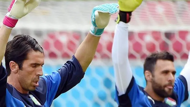 Italy's goalkeepers Gianluigi Buffon (L) and Salvatore Sirigu during a training session at the Arena Pernambuco in Recife, Brazil, 19 June 2014. (RESTRICTIONS APPLY: Editorial Use Only, not used in association with any commercial entity - Images must not be used in any form of alert service or push service of any kind including via mobile alert services, downloads to mobile devices or MMS messaging - Images must appear as still images and must not emulate match action video footage - No alteration is made to, and no text or image is superimposed over, any published image which: (a) intentionally obscures or removes a sponsor identification image; or (b) adds or overlays the commercial identification of any third party which is not officially associated with the FIFA World Cup) ANSA/DANIEL DAL ZENNARO