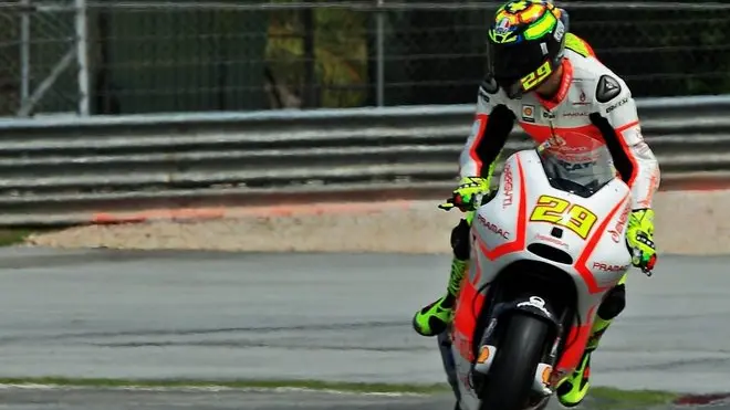 07 Feb 2013, Malaysia --- epa03571612 Italian Andrea Iannone of Pramac Racing Team takes a corner during a pre-season test at the Sepang Circuit, outside Kuala Lumpur, Malaysia, 07 February 2013. EPA/SHAMSHAHRIN SHAMSUDIN --- Image by © SHAMSHAHRIN SHAMSUDIN/epa/Corbis