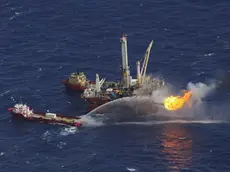 epa03471930 (FILE) A file photograph dated 03 July 2010 showing the oil rig Q4000 at the site of the BP Deepwater Horizon oil well spill site in the Gulf of Mexico off the coast of Louisiana. British oil giant British Petroleum BP could face a fine of between three to five billion US Dollar in a settlement of criminal claims relating to the 2010 Deepwater Horizon oil spill in the Gulf of Mexico, media reports state on 15 November 2012. The fine could be the 'largest criminal penalty in US history', the reports add. The April 2010 Deepwater Horizon oil spill in the Gulf of Mexico had caused a severe environmental disaster in the region. EPA/BOB PEARSON