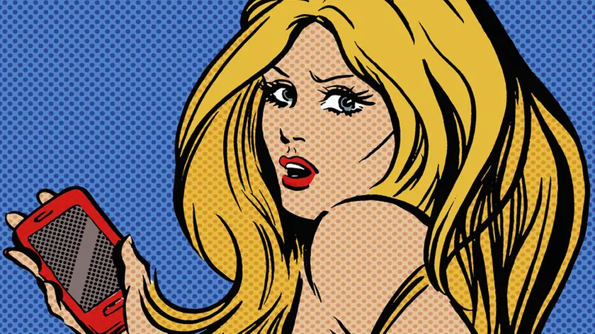Beautiful anxious woman text messaging using smart phone
