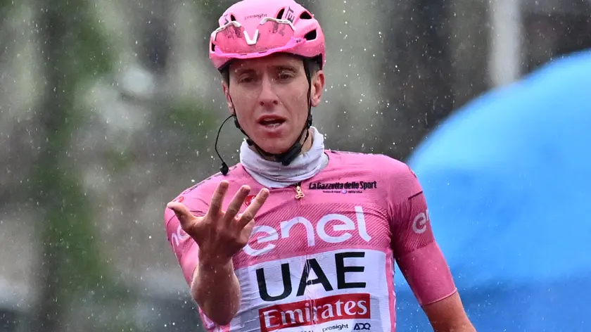 Slovenian rider Tadej Pogacar of Uae Team Emirates celebrates after crossing the finish line and win the 16th stage of the 107 Giro d'Italia 2024, cycling race over 202 km from Livigno to Santa Cristina Valgardena, Italy, 21 May 2024. ANSA/LUCA ZENNARO