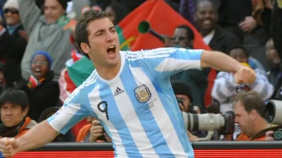 epa02206931 Gonzalo Higuain of Argentina celebrates after scoring the 2-0 lead during the FIFA World Cup 2010 group B preliminary round match between Argentina and South Korea at the Soccer City stadium outside Johannesburg, South Africa, 17 June 2010. EPA/GERRY PENNY Please refer to www.epa.eu/downloads/FIFA-WorldCup2010-Terms-and-Conditions.pdf