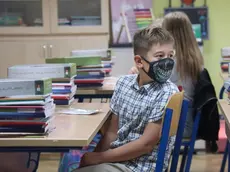 epa08651971 Students wearing face masks sit in their class at school in Zagreb, Croatia, 07 September 2020. Croatian authorities decided to open all schools despite of the SARS-CoV-2 pandemic situation in Croatia. EPA-EFE/STRINGER