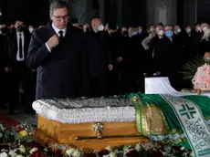 epa08835396 Serbian President Aleksandar Vucic pays last respect to the late Serbian Patriarch Irinej during his funeral at the Saint Sava temple in Belgrade, Serbia, 22 November 2020. According to media reports Patriarch Irinej died on 20 November 2020 in Belgrade, Serbia at the age of 90 after being admitted to a hospital for having symptoms of Covid-19 disease. EPA/ANDREJ CUKIC