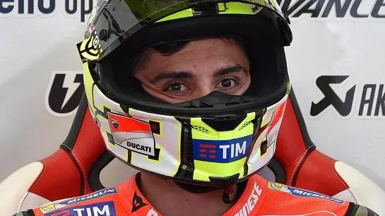 Italian Moto GP rider Andrea Iannone of Ducati Team looks on inside his team's garage during the second training session of the Motorcycling Grand Prix of Italy at the Mugello circuit in Scarperia, central Italy, 20 May 2016. The Motorcycling Grand Prix of Italy will be held on 22 May 2016. ANSA/ETTORE FERRARI