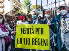 From left: Giulio's mother, Paola Regeni, the lawyer of the Regeni family, Alessandra Ballerini, Luigi Manconi, Marino Sinibaldi and Giulio's father, Claudio Regeni, with Italian journalists of the National Federation of the Italian Press hold banners reading 'the truth for Regeni' outside the court in piazzale Clodio in Rome, Italy, 25 May 2021. The preliminary hearing begins against four Egyptian security officers accused in 2016 of torture and murder in Cairo of an Italian student Giulio Regeni. ANSA / ANGELO CARCONI