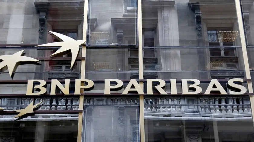 The logo of BNP Paribas is seen on the bank's building in Paris, May 30, 2014. Shares in France's biggest bank BNP Paribas fell sharply on Friday on concerns a possible fine for alleged sanctions after a report in the Wall Street Journal said the U.S. Justice Department wanted $10 billion from the bank - double the amount which had been previously reported. REUTERS/Charles Platiau (FRANCE - Tags: BUSINESS LOGO) - RTR3RHZR