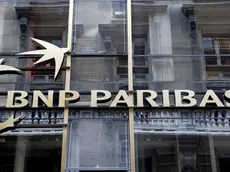 The logo of BNP Paribas is seen on the bank's building in Paris, May 30, 2014. Shares in France's biggest bank BNP Paribas fell sharply on Friday on concerns a possible fine for alleged sanctions after a report in the Wall Street Journal said the U.S. Justice Department wanted $10 billion from the bank - double the amount which had been previously reported. REUTERS/Charles Platiau (FRANCE - Tags: BUSINESS LOGO) - RTR3RHZR