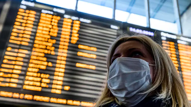 People wearing a protective mask walks at the Termini Station in Rome, Italy, 24 February 2020. Italian authorities announced on the day that there are over 200 confirmed cases of COVID-19 disease in the country, with at least six deaths. Precautionary measures and ordinances to tackle the spreading of the deadly virus included the closure of schools, gyms, museums and cinemas in the affected areas in northern Italy. ANSA/ANGELO CARCONI