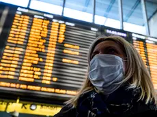 People wearing a protective mask walks at the Termini Station in Rome, Italy, 24 February 2020. Italian authorities announced on the day that there are over 200 confirmed cases of COVID-19 disease in the country, with at least six deaths. Precautionary measures and ordinances to tackle the spreading of the deadly virus included the closure of schools, gyms, museums and cinemas in the affected areas in northern Italy. ANSA/ANGELO CARCONI