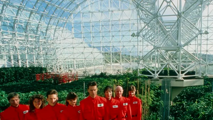 ^BBiosphere 2.^b The 'Biospherians' pose for the camera during the final construction phase of the Biosphere 2 project in 1990. Left to right are: Mark Nelson, Linda Leigh, Taber MacCallum, Abigail Alling, Mark Van Thillo, Sally Silverstone, Roy Walford and Jayne Poynter. The 3.1 acre air- and water-tight building became their home for two years. Biosphere 2 was designed to allow study of human survival in a sealed ecosystem. The costs of this controversial, $150 million project were met from private funds. The Biosphere 2 project building is at Oracle, Arizona.