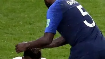 epa06828389 Samuel Umtiti of France (R) comforts Pedro Aquino of Peru after the FIFA World Cup 2018 group C preliminary round soccer match between France and Peru in Ekaterinburg, Russia, 21 June 2018. (RESTRICTIONS APPLY: Editorial Use Only, not used in association with any commercial entity - Images must not be used in any form of alert service or push service of any kind including via mobile alert services, downloads to mobile devices or MMS messaging - Images must appear as still images and must not emulate match action video footage - No alteration is made to, and no text or image is superimposed over, any published image which: (a) intentionally obscures or removes a sponsor identification image; or (b) adds or overlays the commercial identification of any third party which is not officially associated with the FIFA World Cup) EPA/ROMAN PILIPEY EDITORIAL USE ONLY