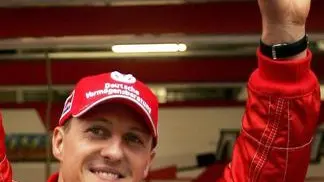 epa03421129 (FILE) A file picture dated 29 September 2006 shows German Formula One driver Michael Schumacher of Scuderia Ferrari waving to spectators after the second practice session in Shanghai, China. Seven-time world champion Formula One driver Michael Schumacher on 04 October 2012 announced his retirement form the sport. The statement ended all speculation that 43-year-old Schumacher may find a new team after Mercedes said it would not renew his contract at the end of the season. EPA/MICHAEL REYNOLDS