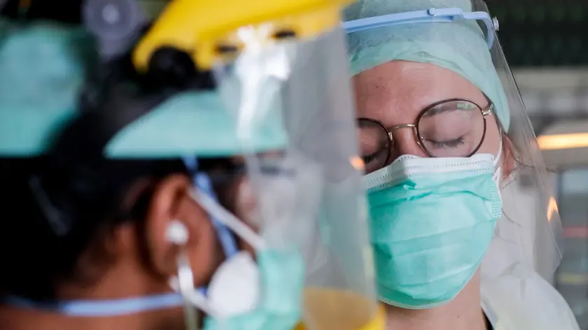 epa08381830 Catherine, nurse and Michal, anesthesiologist, providing care to a patient with COVID-19 in the intensive care unit on the Etterbeek-Ixelles site of the Iris Sud Hospitals in Brussels, Belgium, 24 April 2020.Countries worldwide increased their measures to prevent the widespread of the SARS-CoV-2 coronavirus which causes the COVID-19 disease while crucial businesses like grocery stores, pharmacies, public transportation and health services are still open. EPA/STEPHANIE LECOCQ