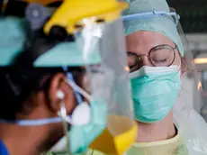 epa08381830 Catherine, nurse and Michal, anesthesiologist, providing care to a patient with COVID-19 in the intensive care unit on the Etterbeek-Ixelles site of the Iris Sud Hospitals in Brussels, Belgium, 24 April 2020.Countries worldwide increased their measures to prevent the widespread of the SARS-CoV-2 coronavirus which causes the COVID-19 disease while crucial businesses like grocery stores, pharmacies, public transportation and health services are still open. EPA/STEPHANIE LECOCQ