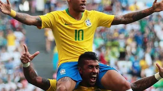 epaselect epa06858223 Neymar (top) of Brazil celebrates with teammate Paulinho after scoring the 1-0 during the FIFA World Cup 2018 round of 16 soccer match between Brazil and Mexico in Samara, Russia, 02 July 2018. (RESTRICTIONS APPLY: Editorial Use Only, not used in association with any commercial entity - Images must not be used in any form of alert service or push service of any kind including via mobile alert services, downloads to mobile devices or MMS messaging - Images must appear as still images and must not emulate match action video footage - No alteration is made to, and no text or image is superimposed over, any published image which: (a) intentionally obscures or removes a sponsor identification image; or (b) adds or overlays the commercial identification of any third party which is not officially associated with the FIFA World Cup) EPA/WALLACE WOON EDITORIAL USE ONLY