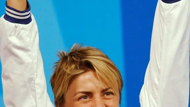 ATENE 2004: TIRO A SEGNO; TURISINI,SAPEVO DI ESSERE IN FORMA. Valentina Turisini from Italy jubilates after she won silver in the women's 50m Rifle 3 Positions qualification at the Athens Olympic Games, Friday 20 August 2004. Lioubov Galkina from Russia won gold, Valentina Turisini from Italy took silver, chinese Chengyi Wang won bronze. ANSA/A3216 Peter Kneffel/RED