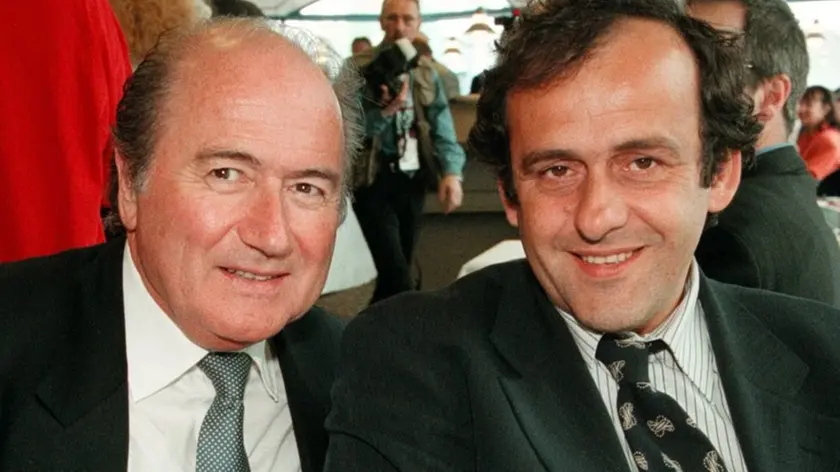 ICH01-19980501-ZURICH, SWITZERLAND: Michel Platini (r), president of the organizing committee of the France 98 World Cup, and Joseph Blatter, FIFA secretary general, chat together during a reception before the opening of the Ice Hockey World Championship in Zurich 01 May. Blatter will run for the presidency of the FIFA soccer association in elections to be held in Paris on June 08. EPA/KEYSTONE/CHRISTOPH RUCKSTUHL