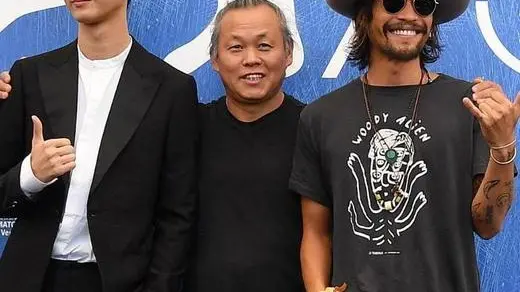 South Korean director Kim Ki-duk (C) poses with South Korean actors Lee Won-gun (L) and Ryoo Seung-bum (R) during a photocall for 'Geumul' (The Net) during the 73rd Venice Film Festival in Venice, Italy, 01 September 2016. The movie is presented in the 'Cinema nel Giardino' section at the festival running from 31 August to 10 September. ANSA/ETTORE FERRARI