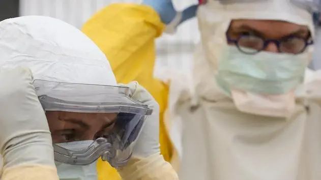 epa04454706 Medical personnels of Medicins sans Frontieres (MSF) (doctors without boarders) attend an Ebola security training session, during a press visit, at the Ebola MSF World training center in Brussels , Belgium, 20 October 2014 prior to departing for affected African countries. MSF state that since April, hundreds of medical personnel have already passed through the Brussels training center. EPA/OLIVIER HOSLET