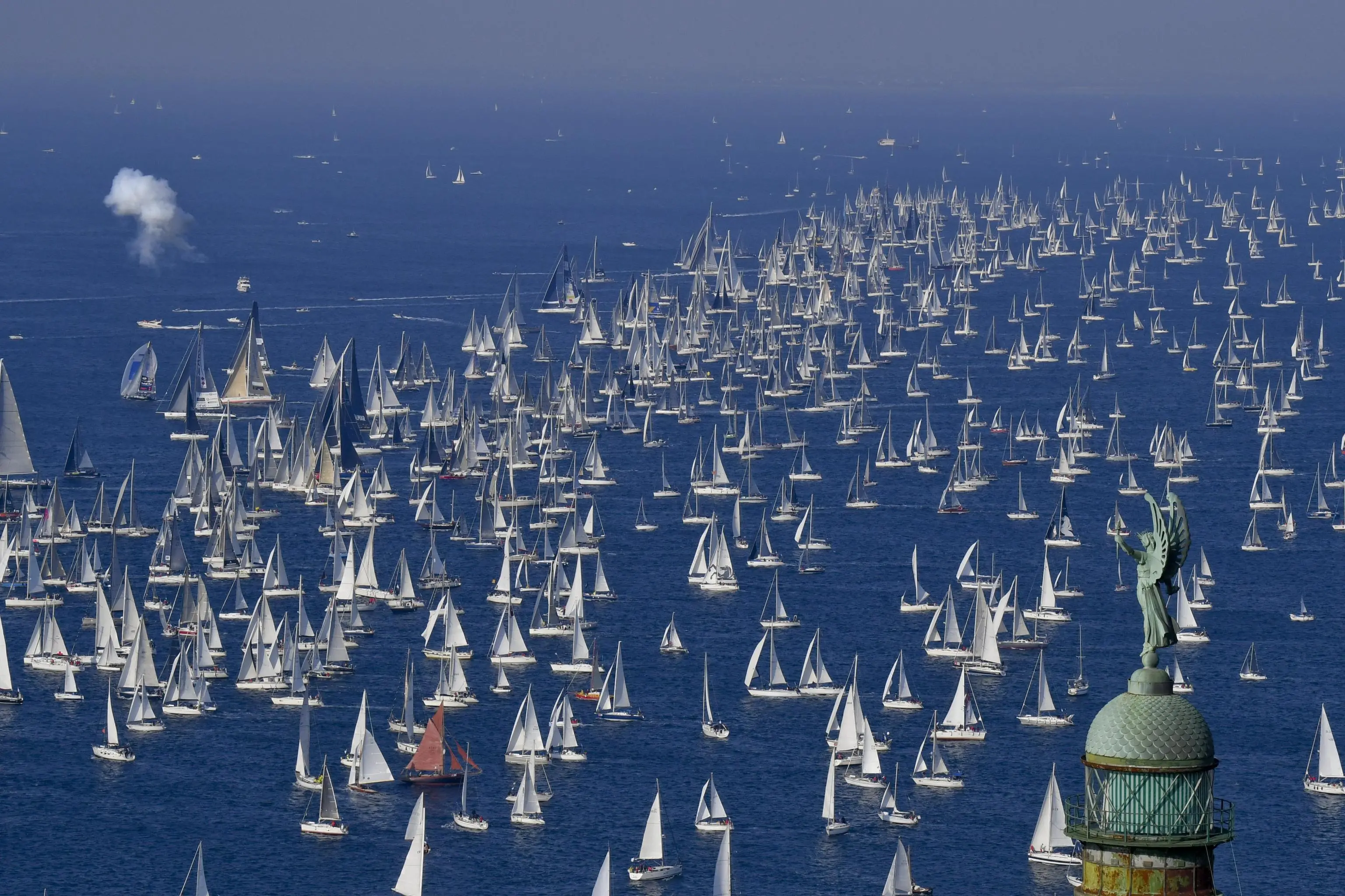 The 'Victory Lighthouse' overlooks hundreds of sailing boats as they crowd the Gulf of Trieste at the start of the 50th edition of the traditional 'Autumn Cup - Barcolana' regatta in Trieste, Italy, 14 October 2018. ANSA / CIRO FUSCO