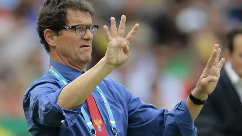 Russia's head coach Fabio Capello, left, gestures as he stands near Belgium's head coach Marc Wilmots, right, on the touchline during the group H World Cup soccer match between Belgium and Russia at the Maracana stadium in Rio de Janeiro, Brazil, Sunday, June 22, 2014. (AP Photo/Ivan Sekretarev)