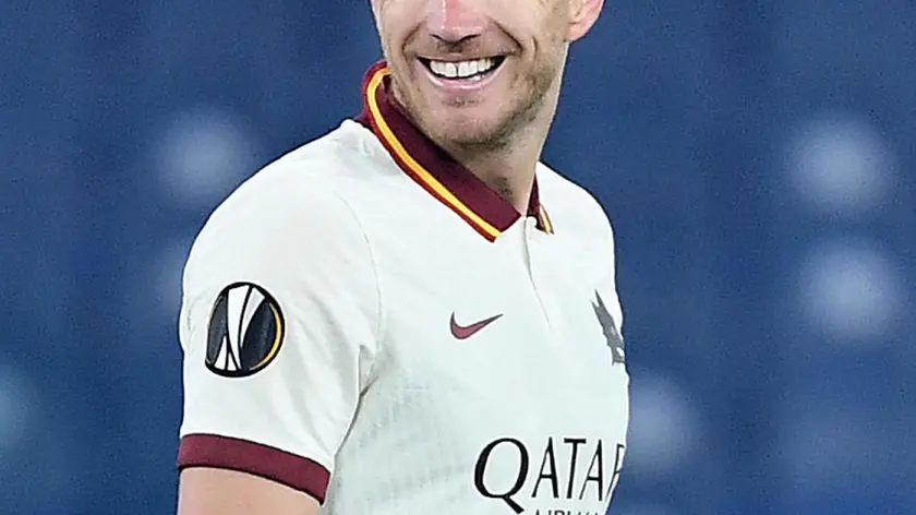 AS Roma's Edin Dzeko smiles after scoring the goal during the UEFA Europa League quarterfinal second leg soccer match between AS Roma and Ajax Amsterdam at Olimpico stadium in Rome, Italy, 15 April 2021. ANSA/ETTORE FERRARI
