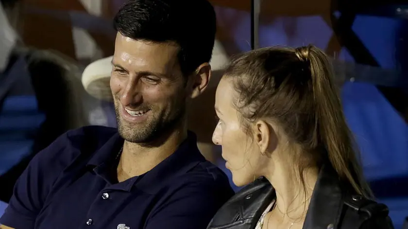 epa08485565 Novak Djokovic (L) of Serbia with his wife Jelena (R) watch the final match between Filip Krajinovic of Serbia and Dominic Thiem of Austria at the Adria Tour tennis tournament in Belgrade, Serbia, 14 June 2020. The Adria Tour will be held until 05 July in a number of Balkan countries. EPA/ANDREJ CUKIC